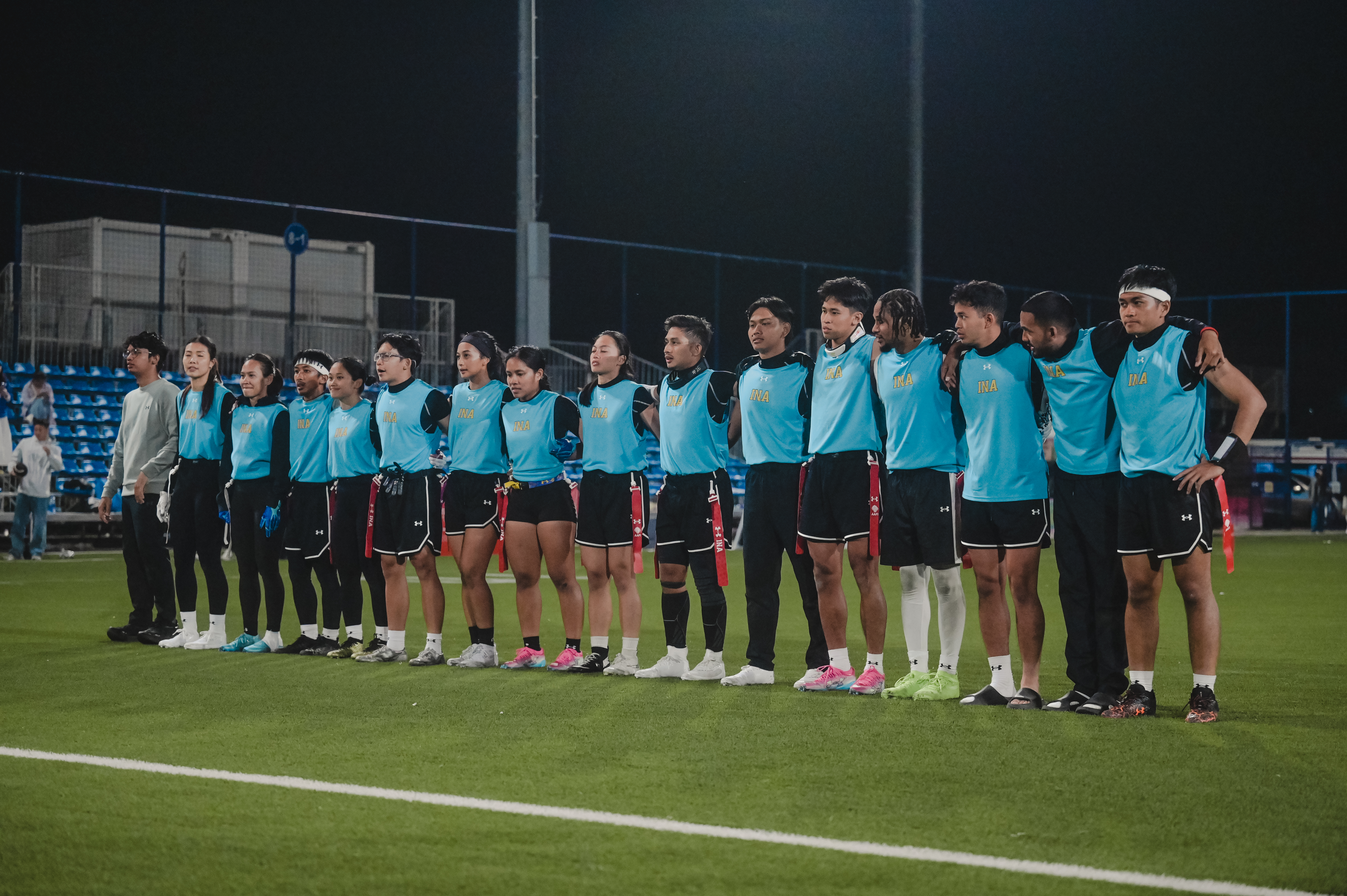 Tim Indonesia berbaris di lapangan Wuhan Three City Soccer Training Center sebelum bertanding